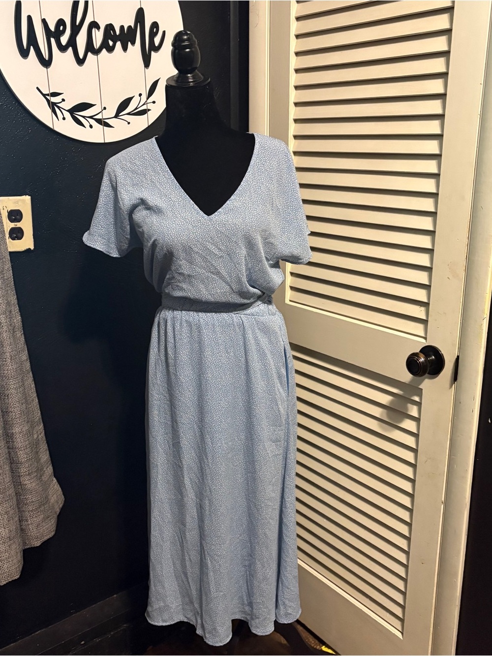 Sienna Sky light blue midi dress with a V-neckline and elastic waist Size Small